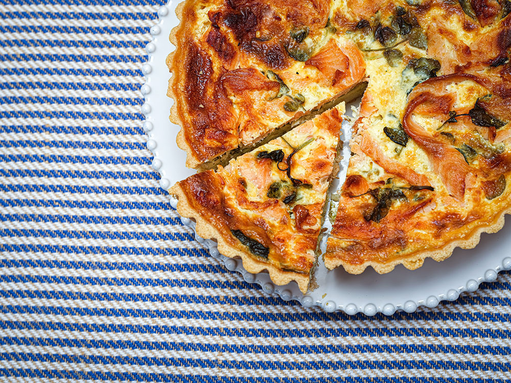 quiche on blue striped background, deli food